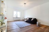 Wohnzimmer Beispiel - 3-Zimmer-Wohnung mit Garten